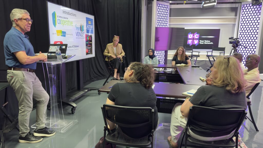 2025 NPO Cohort sits in Studio A at DCTV listening to a special guest presenting the training for a session of the Fellowship.